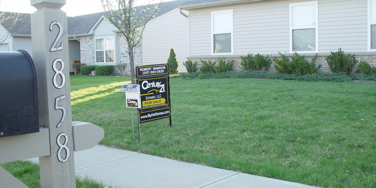 Home ownership — real estate sign